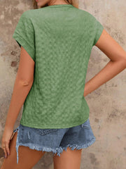 Sage green woven texture cap-sleeve blouse with a relaxed fit.