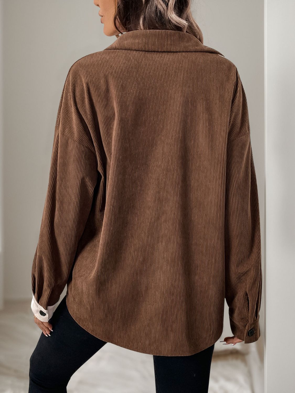 Colorblock corduroy shirt in coffee brown with asymmetrical paneling and buttoned cuffs.