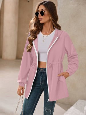 Dusty pink hooded jacket with cinched waistline and white zipper detail