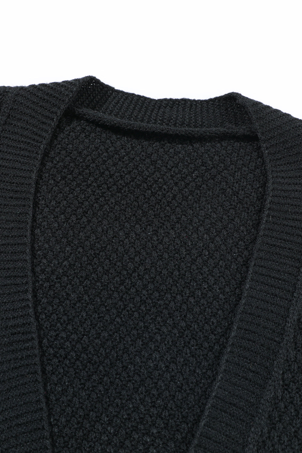 Black acrylic knit cardigan with textured stitch and V-neck detail
