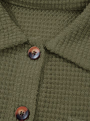 Moss waffle-knit collared shirt with button detail and tortoiseshell buttons.
