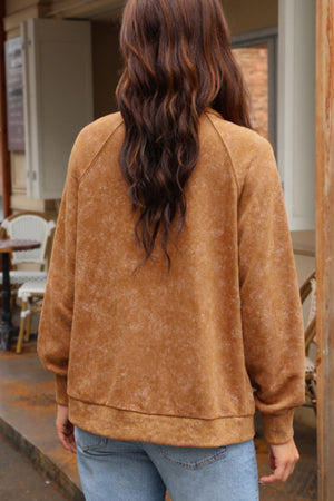 Washed cotton utility jacket in caramel with a relaxed fit and crew neck.