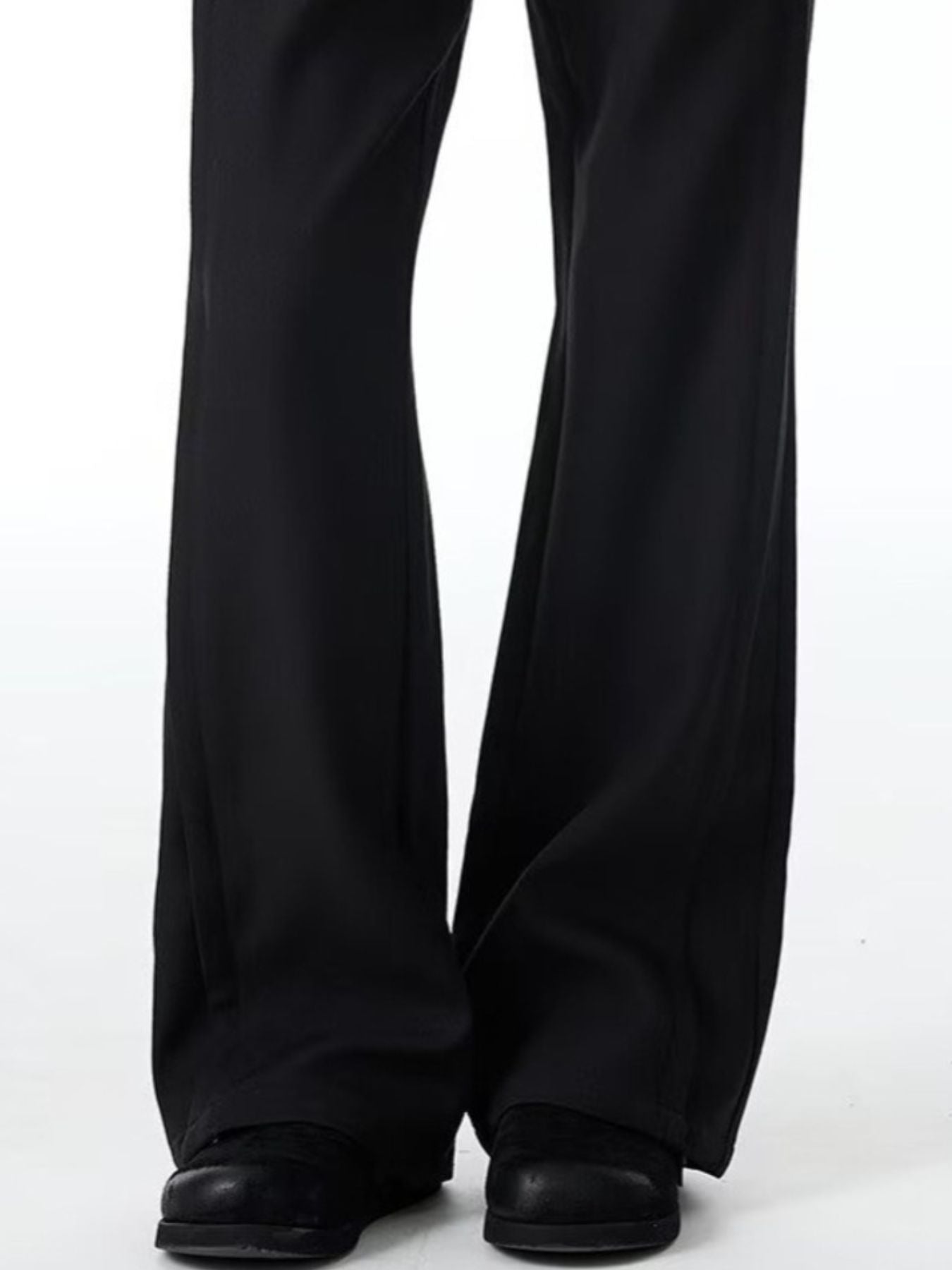 Men's black wide-leg trousers with a full-length cut.