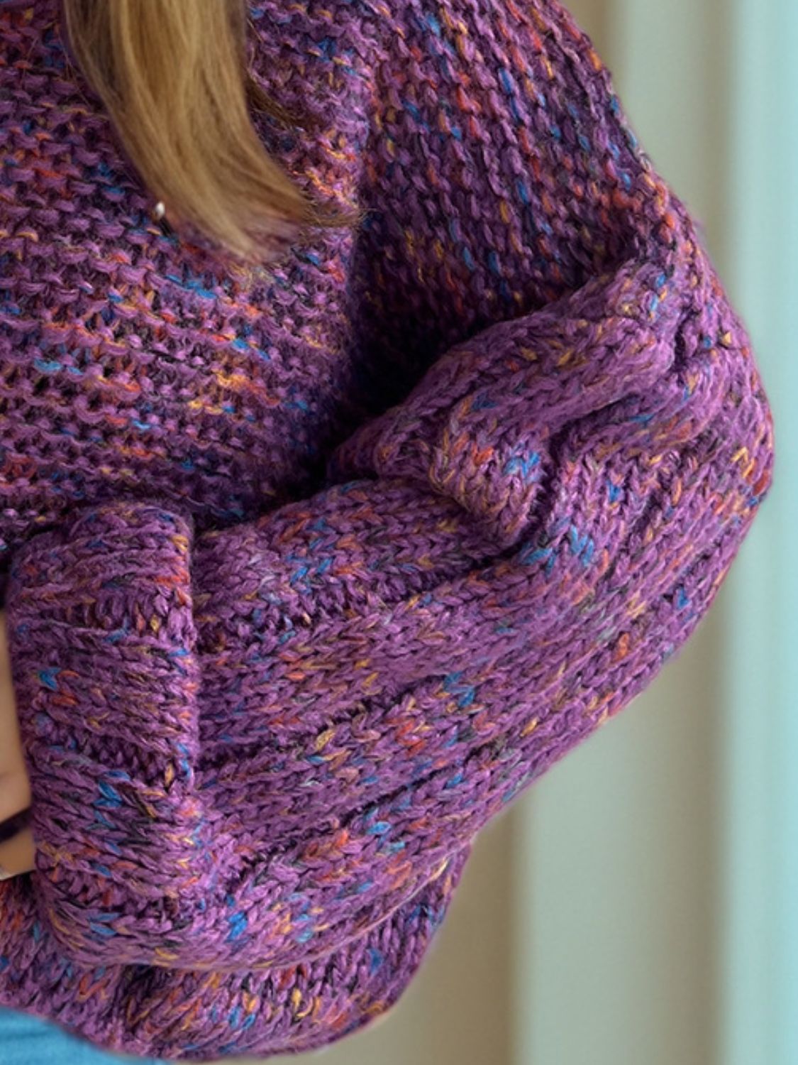 Textured purple knit sweater with balloon sleeves and multi-color flecks.