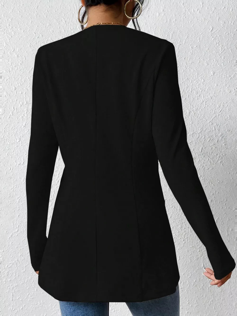 Black single-button blazer with tailored fit and long sleeves.