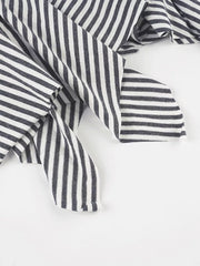 Asymmetrical hem mini skirt in black and white stripes with a soft knit fabric.
