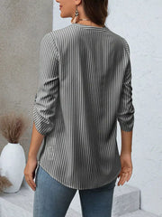 Vertical stripe V-neck blouse with roll-up sleeves in dark blue bar.