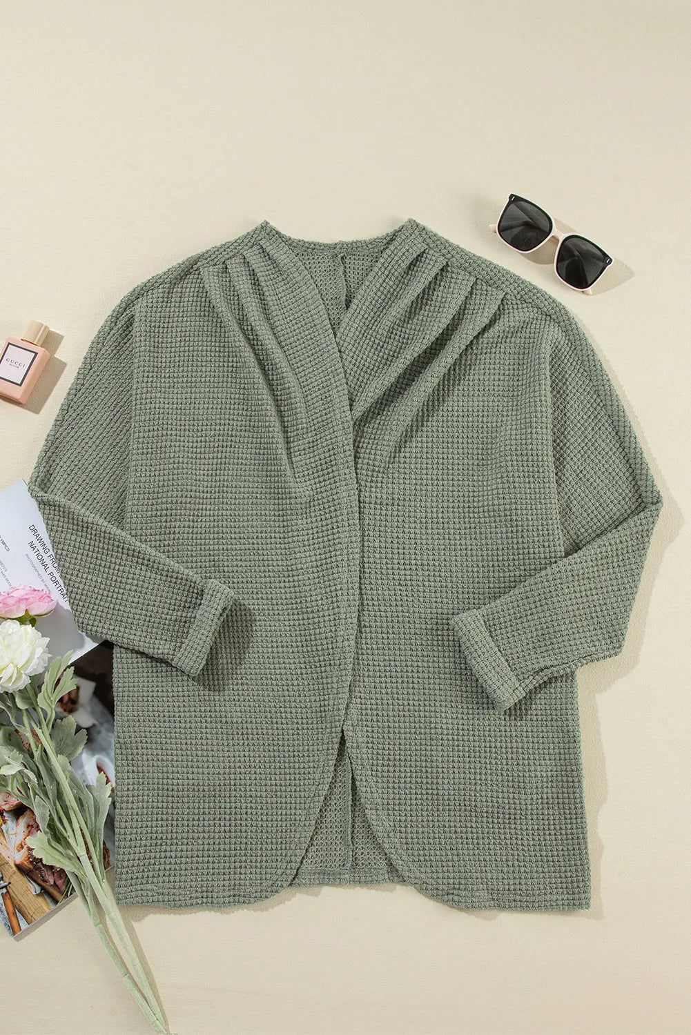 Sage waffle knit open-front duster cardigan with a draped neckline and rolled cuffs.