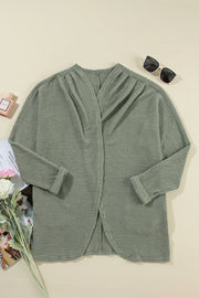 Sage waffle knit open-front duster cardigan with a draped neckline and rolled cuffs.