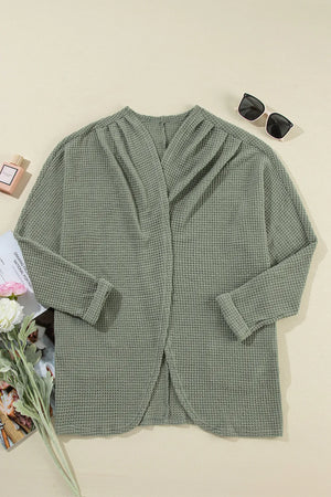 Sage waffle knit open-front duster cardigan with a draped neckline and rolled cuffs.