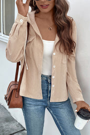 Sand ribbed button-up hoodie jacket with white buttons and a white tank top.