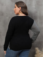 Colorblock crossover knit sweater in dark gray and black acrylic with a bold silhouette.