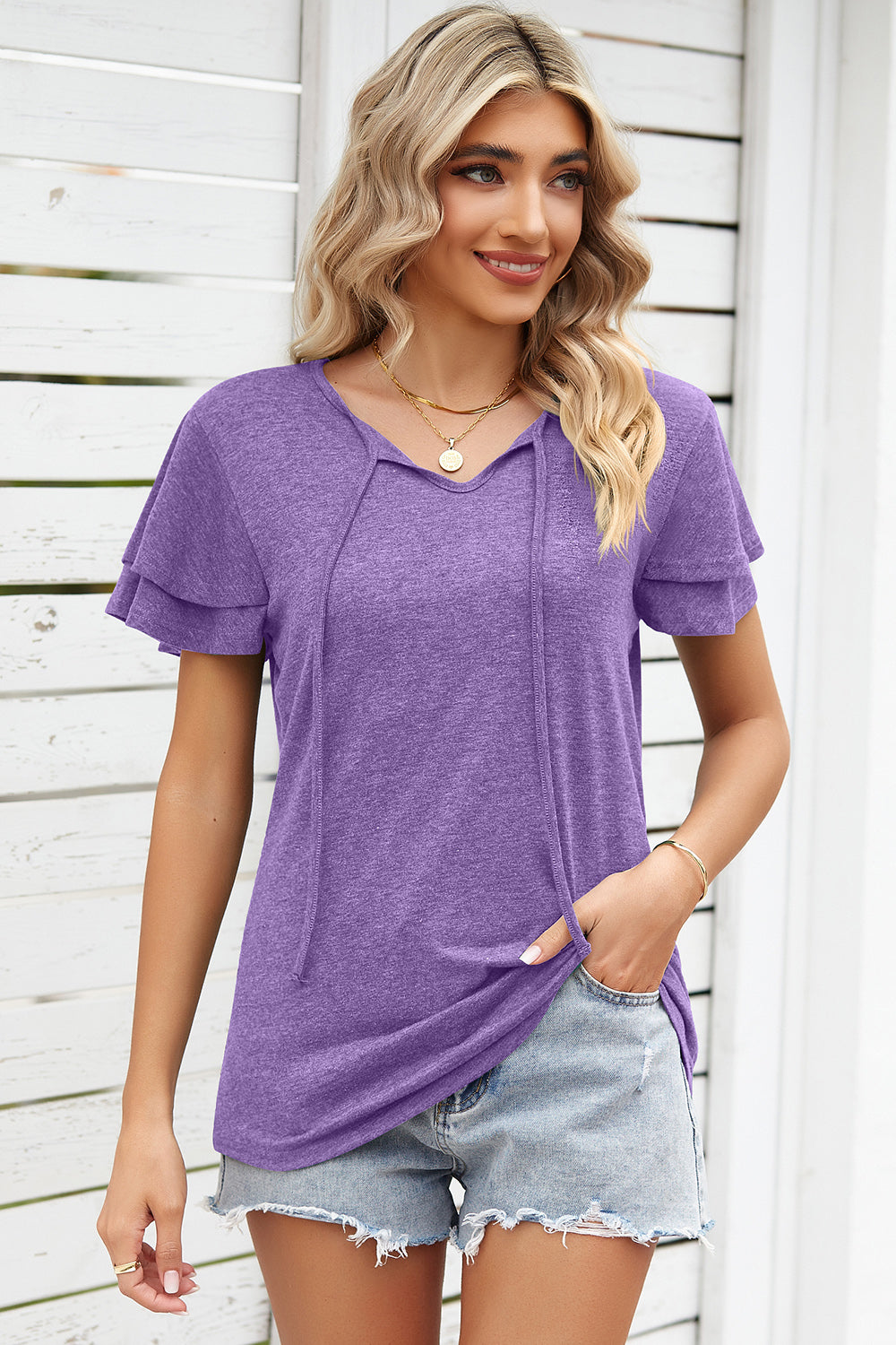 Lavender flutter sleeve henley tee with tie neckline and layered sleeves.