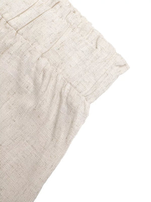Beige maternity wide-leg trousers with drawstring detail and textured fabric.