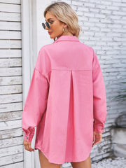 Pink oversized denim shirt with back pleat detail and button cuffs