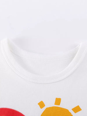 White baby t-shirt with cartoon sun graphic and crew neck.