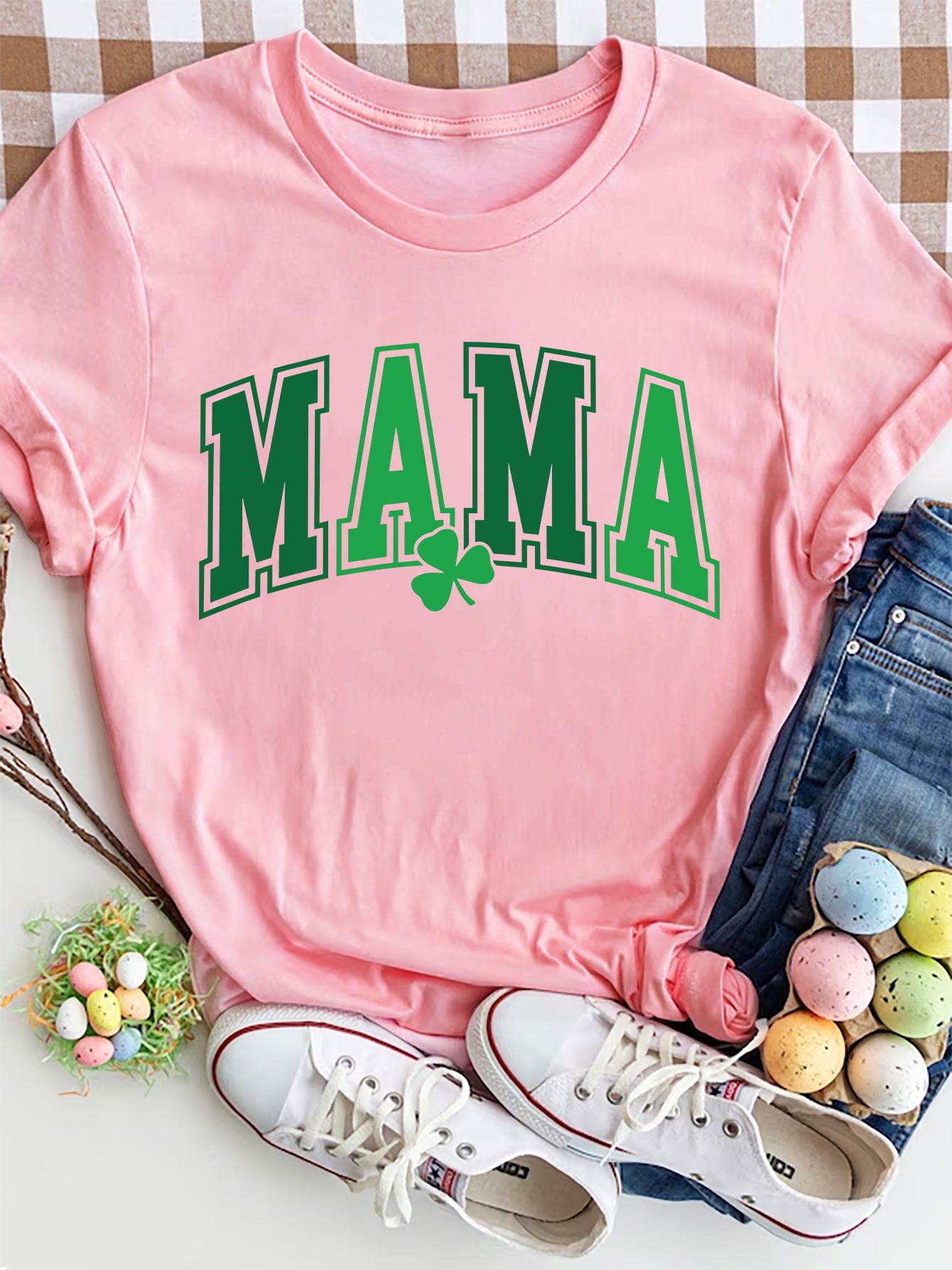 Pink t-shirt with green "MAMA" graphic and shamrock detail