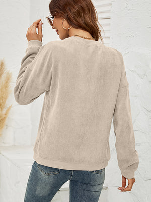 Sand corduroy sweatshirt with crewneck and long sleeves, detailed view of back.