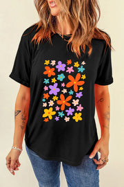 Black round neck tee with colorful bloom print and rolled sleeves