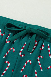Deep Teal pajama pants with a candy cane print and drawstring waist.