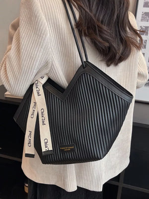 Black ribbed texture large shoulder bag with white logo strap