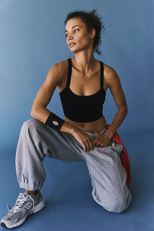 Black ribbed active tank top with scoop neck and wide straps.