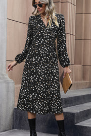 Black floral midi wrap dress with button front and tie waist.