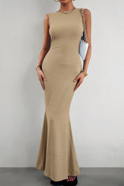 Textured sand maxi dress with a fishtail hem and crew neck.