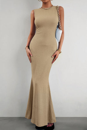 Textured sand maxi dress with a fishtail hem and crew neck.