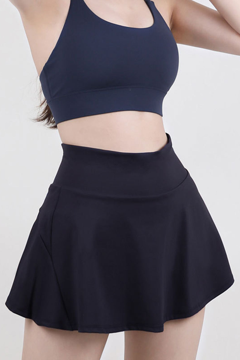 Dark Blue sculpted flared active skort with a high waist and breathable fabric.