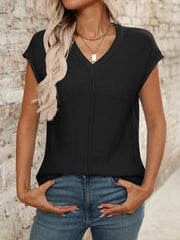 Black seamed knit sleeveless V-neck top with a vertical seam detail.