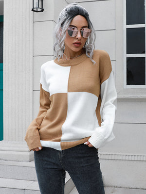 Colorblock knit sweater in camel and white acrylic with a crew neck and long sleeves.