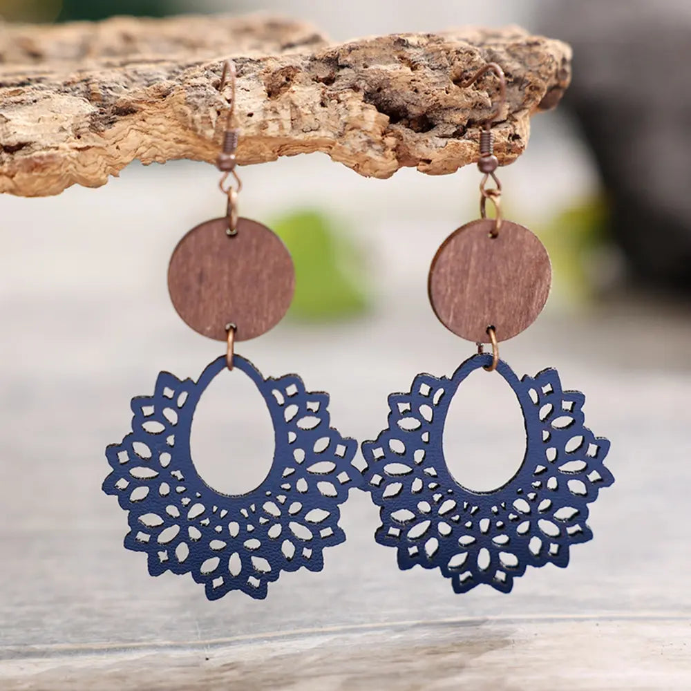 Floral laser-cut wooden drop earrings in Dusty Blue with intricate cutouts and round wood tops.