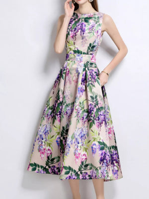 Wisteria floral print midi dress in blush pink with a-line cut and round neckline.