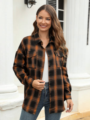 Plaid button-up shirt in brown and black with two chest pockets.