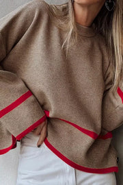 Mocha ribbed knit pullover sweater with red trim details on sleeves and hem.