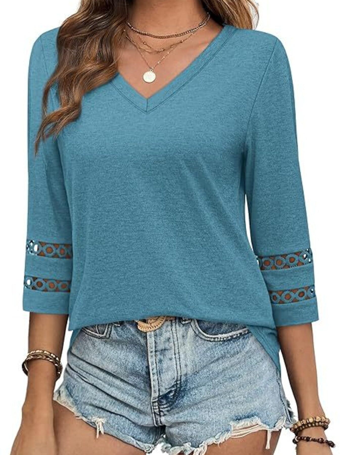 Blue V-neck t-shirt with 3/4 sleeves featuring cutout details on the cuffs.