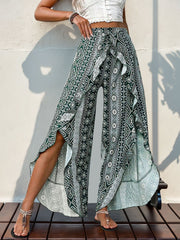 Geometric print palazzo pants in Air Force Blue with ruffle trim and high slits.