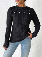Black cable knit sweater with pearl embellishments and crew neck.