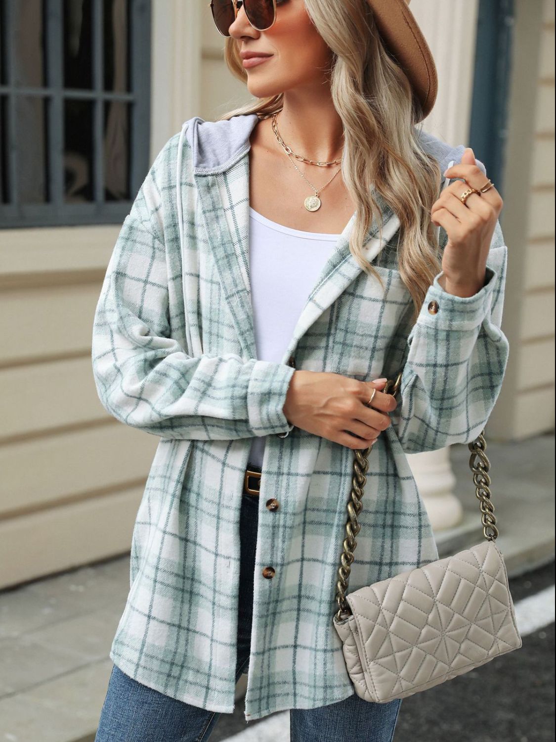 Light green plaid shacket with contrast hood and button details.