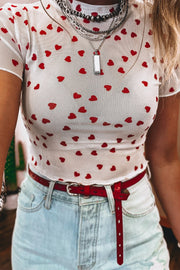 White sheer t-shirt with red hearts, short sleeves, and a cropped fit.