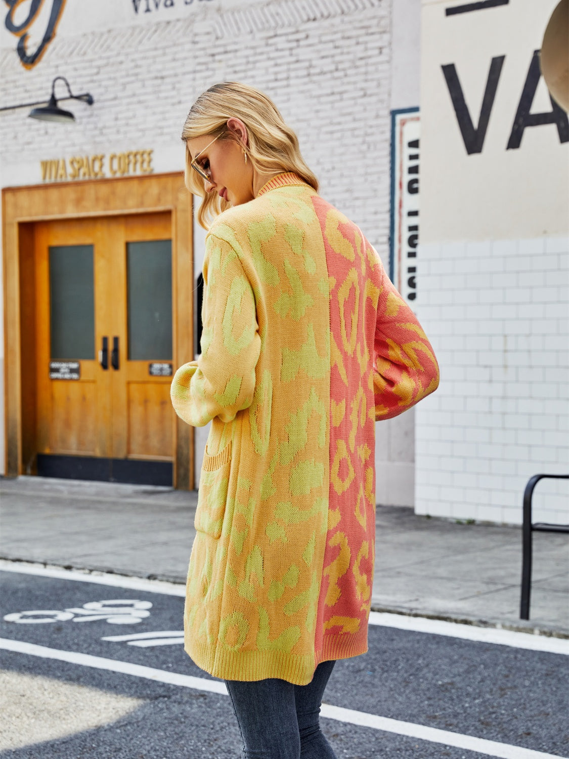 Colorblock leopard knit duster cardigan in banana yellow and brick red acrylic with pockets.