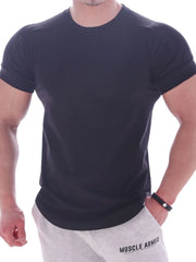 Black performance tee with curved hemline and short sleeves