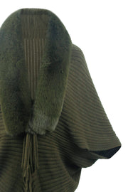 Army green knit cape with faux fur collar and fringe detail