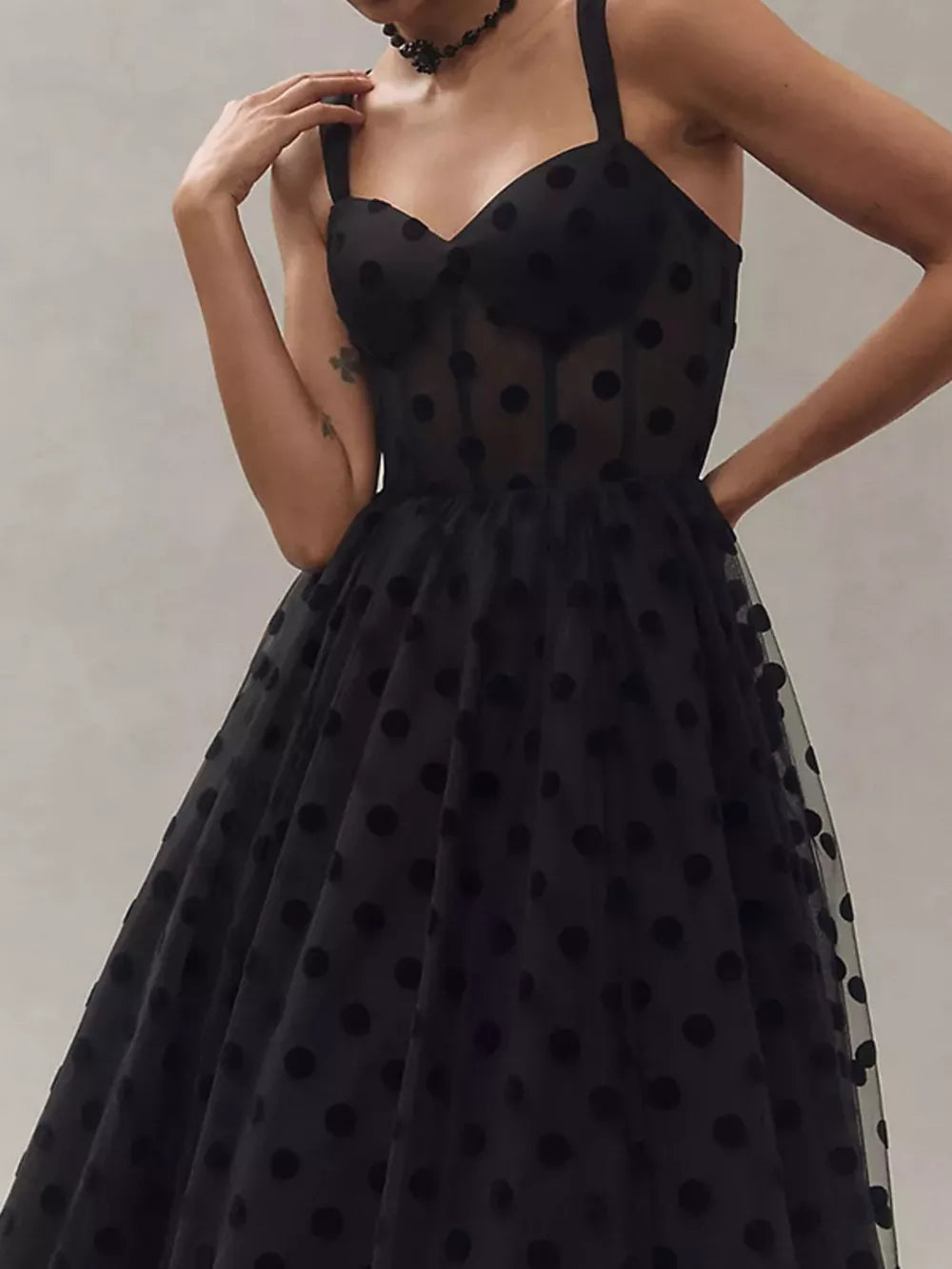 Black polka dot tulle dress with sweetheart neckline and spaghetti straps.
