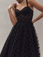 Black polka dot tulle dress with sweetheart neckline and spaghetti straps.