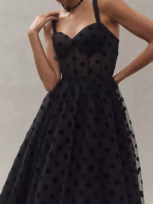 Black polka dot tulle dress with sweetheart neckline and spaghetti straps.