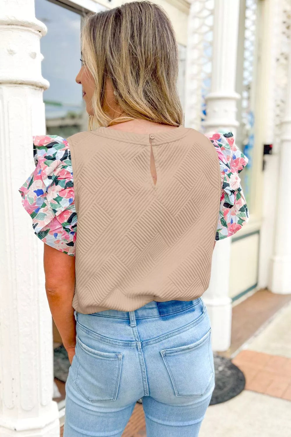 Beige geometric textured shirt with floral flutter sleeves and a keyhole back detail.