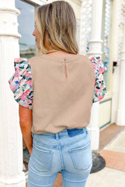 Beige geometric textured shirt with floral flutter sleeves and a keyhole back detail.