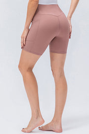 Dusty Pink ribbed bike shorts with pockets and a cross-waist detail.